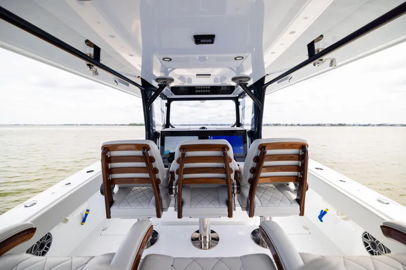 Slide: The Image of Interior view of 2025 Freeman 42 LR boat with luxurious seating and helm. - 32