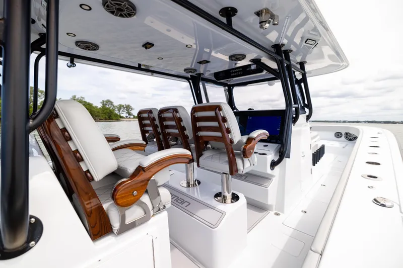 Slide: The Image of Luxury interior of 2025 Freeman 42 LR boat with elegant seating and advanced controls. - 33