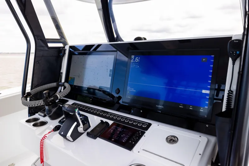 Slide: The Image of Control panel of 2025 Freeman 42 LR boat with navigation screens and equipment. - 35