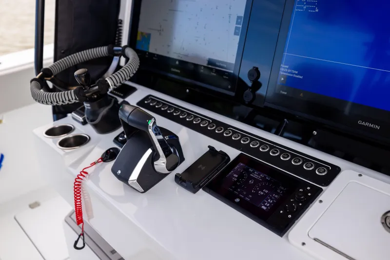 Slide: The Image of Control panel of 2025 Freeman 42 LR boat with advanced navigation systems. - 36