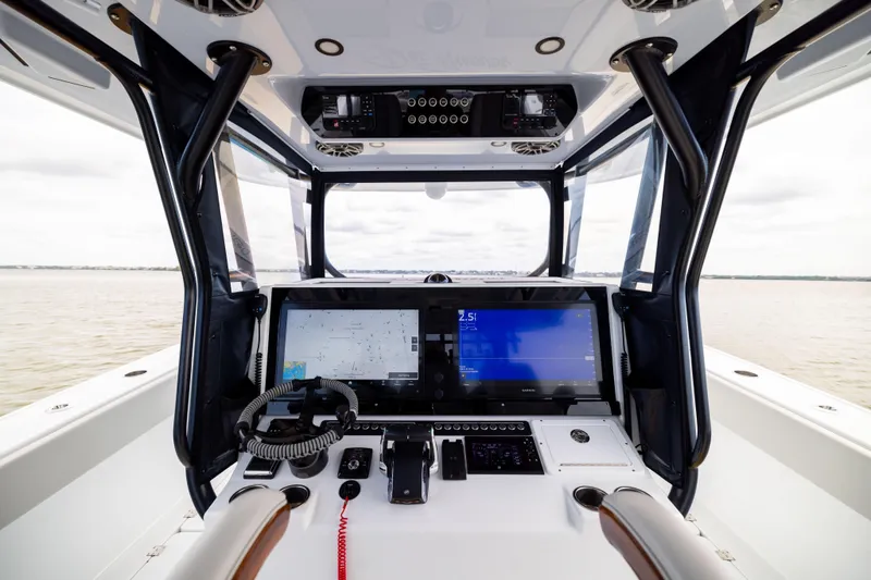Slide: The Image of Cockpit view of 2025 Freeman 42 LR boat with advanced navigation system. - 38