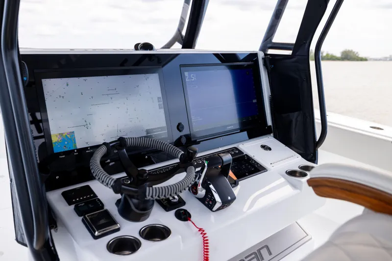 Slide: The Image of Freeman 42 LR 2025 boat dashboard with advanced navigation screens and controls. - 41