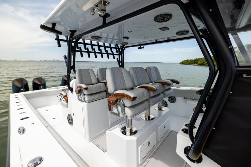 Slide: The Image of Luxurious 2025 Freeman 42 LR boat interior with plush seating and scenic water view. - 45