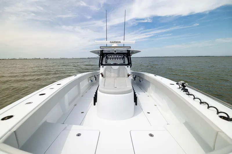 Slide: The Image of 2025 Freeman 42 LR boat on open water, featuring spacious deck and modern design. - 49