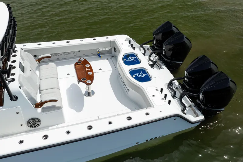 Slide: The Image of Freeman 42 LR 2025 boat with four engines and spacious deck in water. - 5