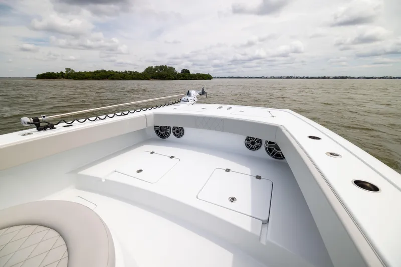 Slide: The Image of 2025 Freeman 42 LR boat on water, featuring spacious deck and modern design. - 52