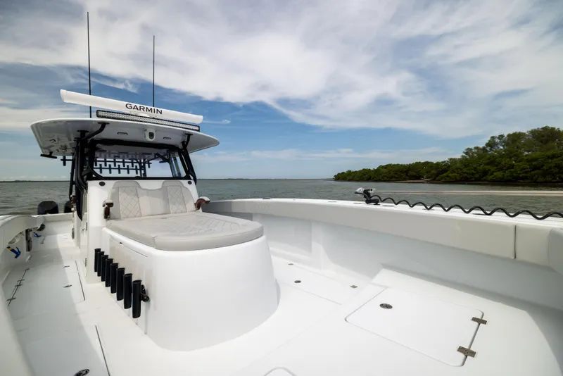 Slide: The Image of 2025 Freeman 42 LR boat on water, featuring spacious deck and advanced navigation system. - 58