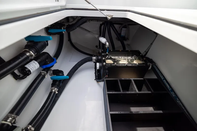 Slide: The Image of Engine compartment of 2025 Freeman 42 LR boat, showcasing pipes and mechanical components. - 64
