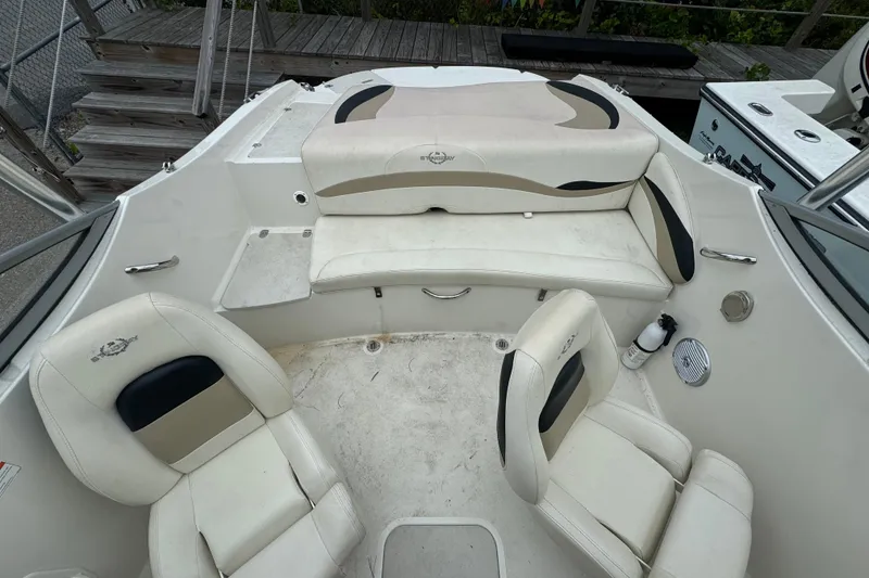Slide: The Image of 2016 Stingray 198 RX boat interior with white seating and black accents. - 4