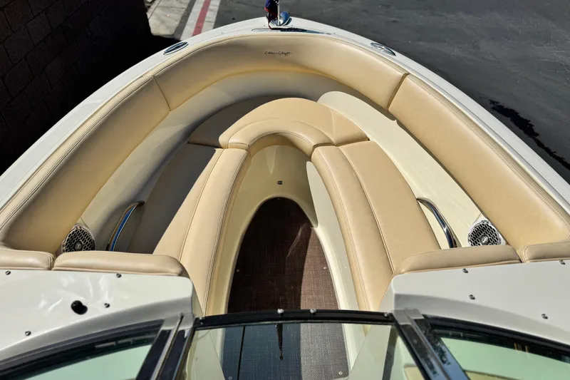 Slide: The Image of 2013 Chris-Craft Launch 22 boat interior with beige seating and sleek design. - 10