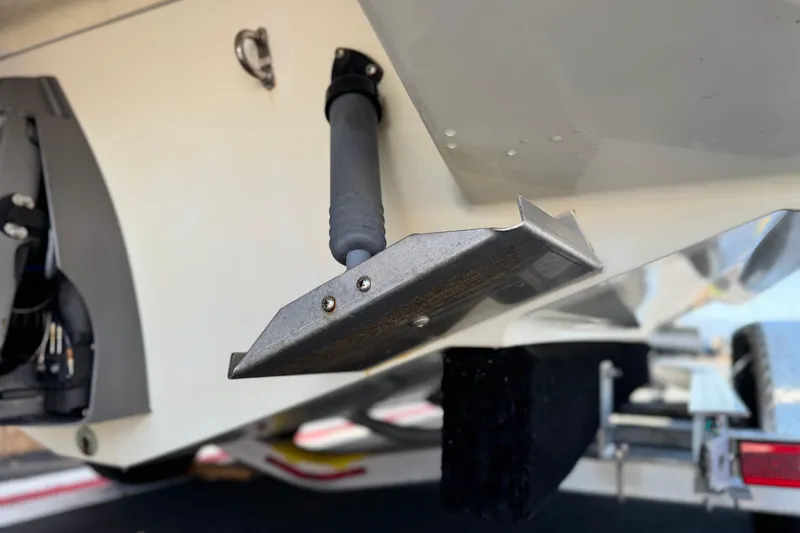 Slide: The Image of 2013 Chris-Craft Launch 22 boat detail showing trim tab and hull components. - 7