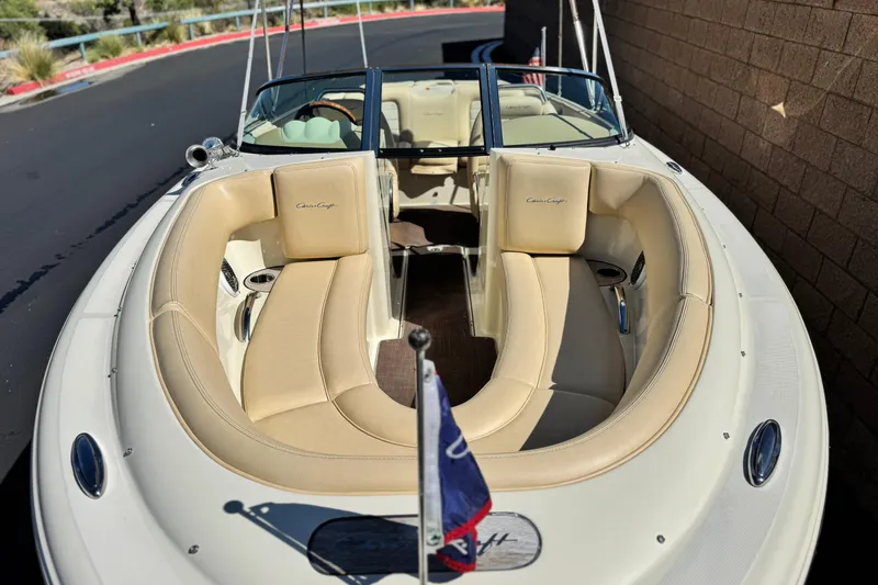 Slide: The Image of 2013 Chris-Craft Launch 22 boat with beige seating and sleek design. - 9
