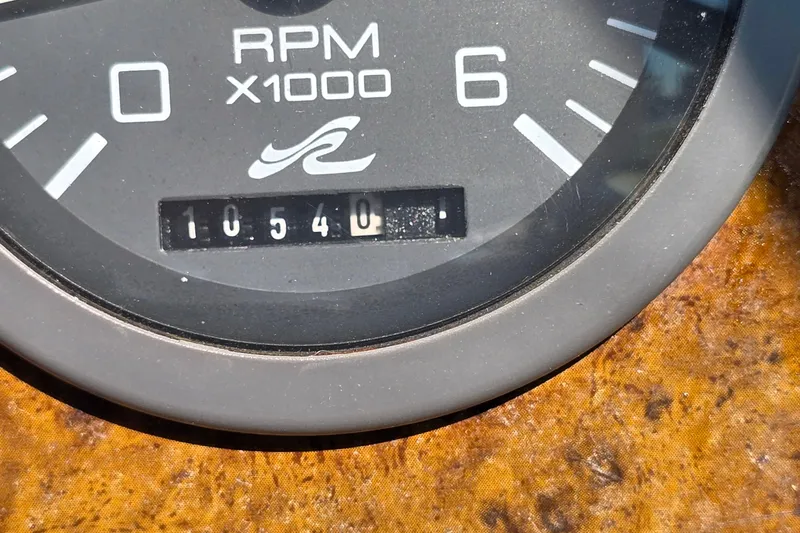 Slide: The Image of Close-up of 1995 Sea Ray 330 Sundancer RPM gauge showing 10540 hours. - 12
