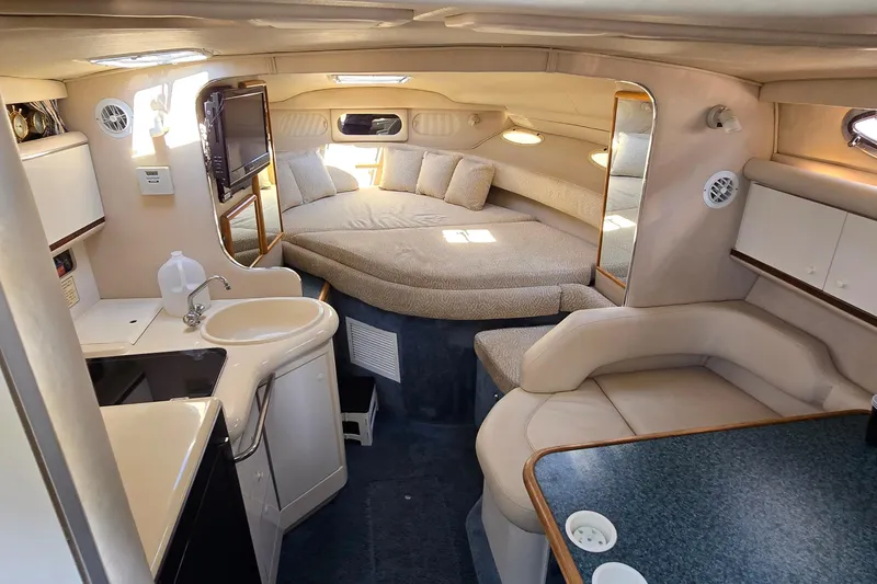 Slide: The Image of Interior of 1995 Sea Ray 330 Sundancer yacht with cozy seating and kitchenette. - 20