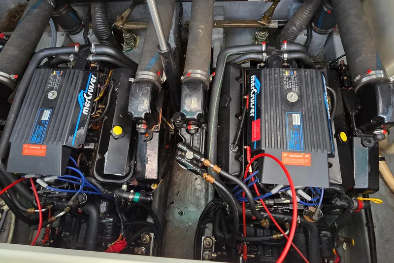 Slide: The Image of Engine compartment of a 1995 Sea Ray 330 Sundancer with twin MerCruiser engines. - 35