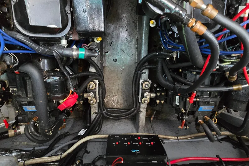 Slide: The Image of Engine compartment of a 1995 Sea Ray 330 Sundancer with visible wiring and components. - 37