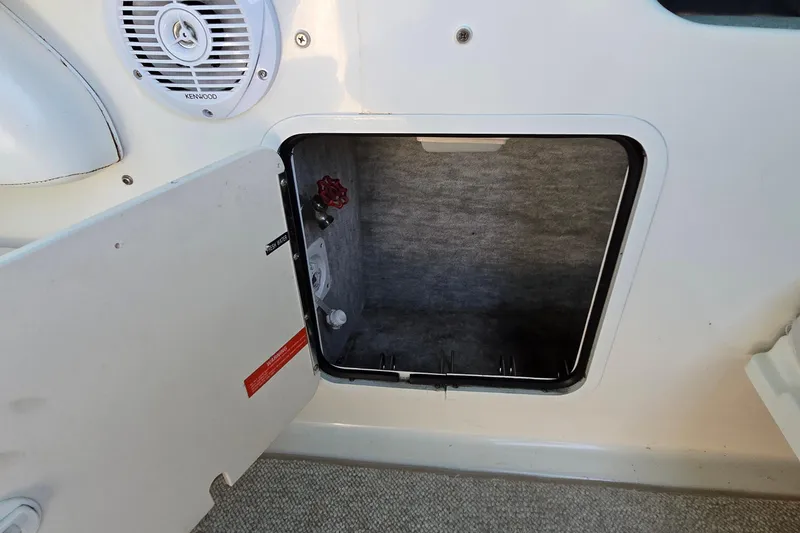 Slide: The Image of Open storage compartment on 1995 Sea Ray 330 Sundancer boat, featuring interior details. - 7