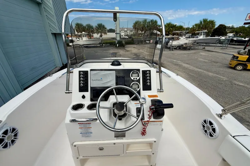 Slide: The Image of 2018 Robalo R180 Center Console boat dashboard with Garmin navigation system. - 5