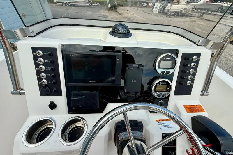 Slide: The Image of 2018 Robalo R180 Center Console dashboard with Garmin display and Yamaha gauges. - 6
