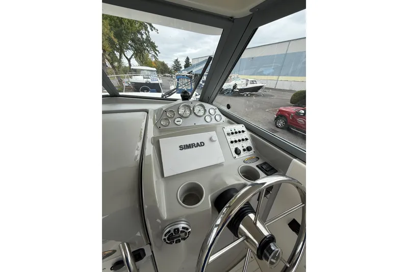 Slide: The Image of 2007 Bayliner 246 Discovery boat dashboard with Simrad navigation system. - 14