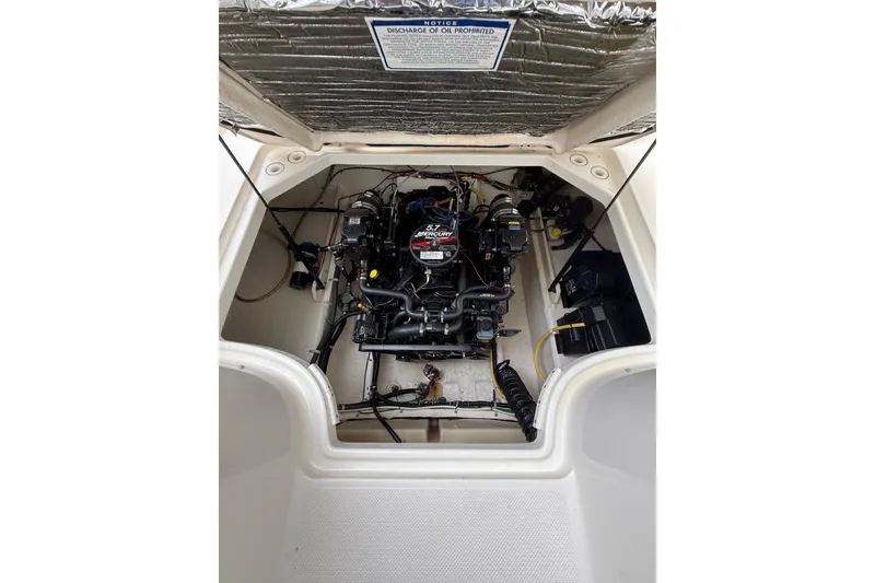 Slide: The Image of Engine compartment of 2007 Bayliner 246 Discovery boat, showcasing the MerCruiser engine. - 25