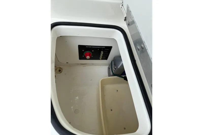 Slide: The Image of Battery compartment of 2007 Bayliner 246 Discovery boat with management panel. - 26