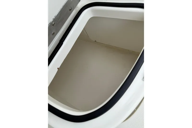 Slide: The Image of Storage compartment of 2007 Bayliner 246 Discovery boat, featuring a clean interior. - 27