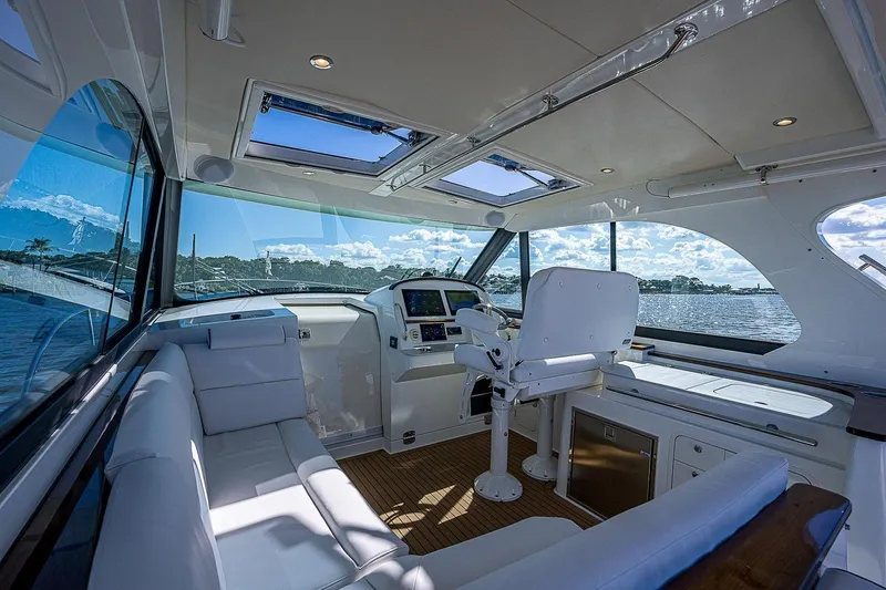 Slide: The Image of Luxurious interior of 2023 Hinckley 40x yacht with panoramic windows and plush seating. - 13
