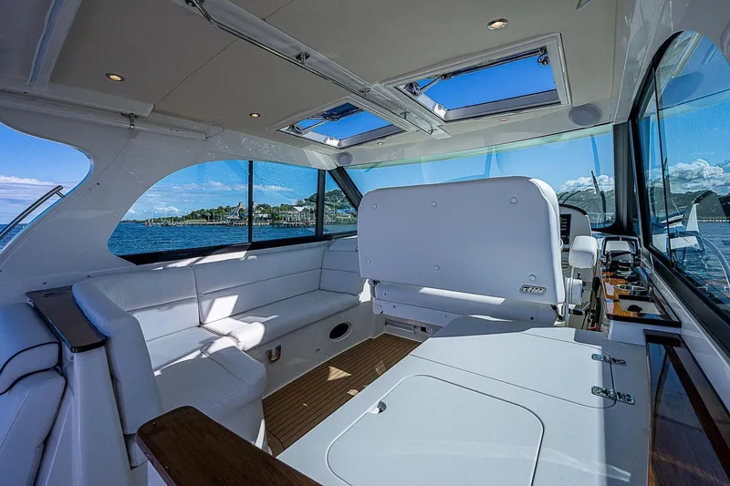 Slide: The Image of Luxurious interior of 2023 Hinckley 40x yacht with panoramic windows and plush seating. - 14