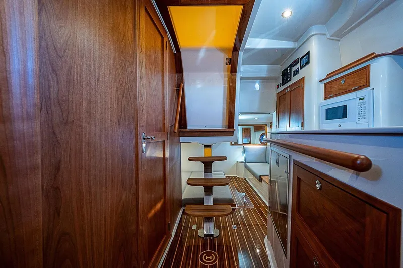 Slide: The Image of Luxurious interior of 2023 Hinckley 40x yacht with wooden finishes and modern amenities. - 20