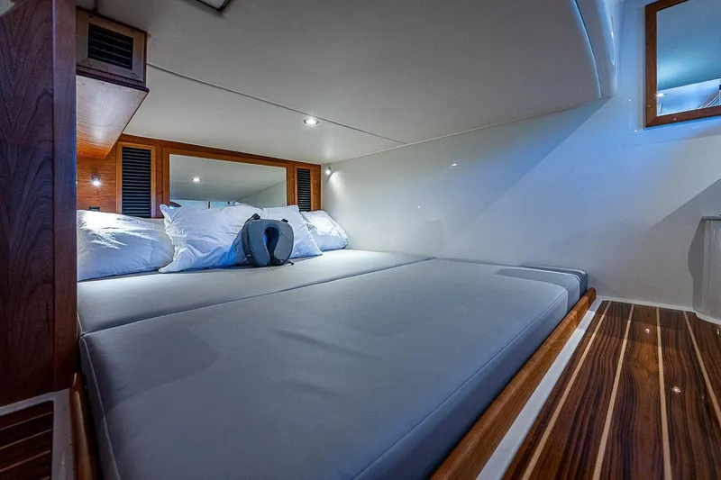 Slide: The Image of Luxurious cabin interior of 2023 Hinckley 40x yacht with modern bedding. - 21