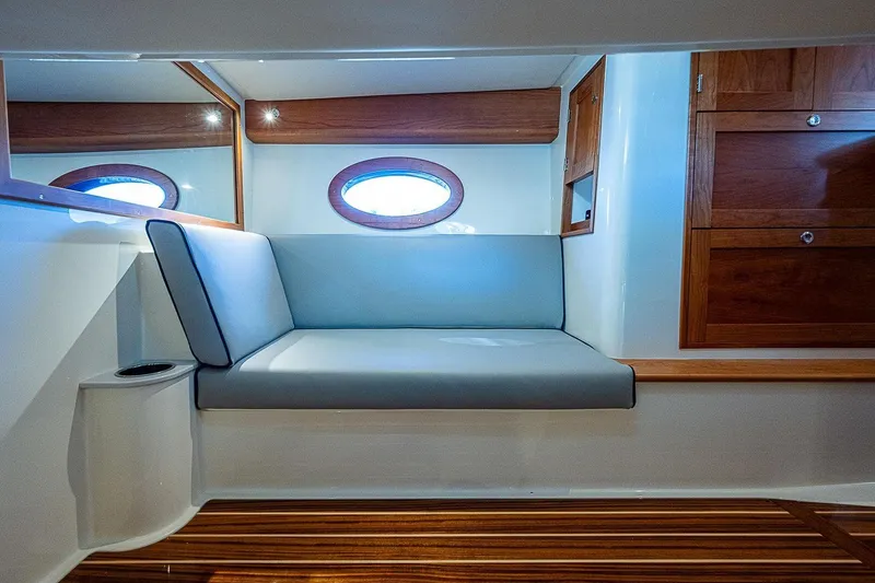 Slide: The Image of Luxurious interior of 2023 Hinckley 40x yacht with elegant seating and wooden accents. - 22