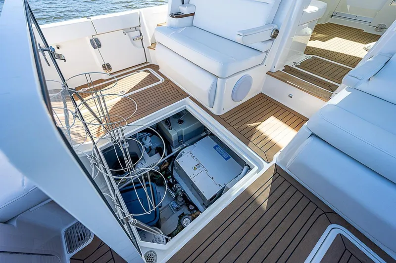 Slide: The Image of Hinckley 40x 2023 boat interior with open engine compartment, showcasing modern design and functionality. - 23