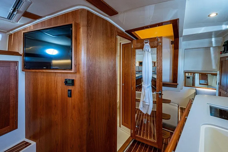 Slide: The Image of Luxurious interior of 2023 Hinckley 40x yacht with wood paneling and modern amenities. - 24