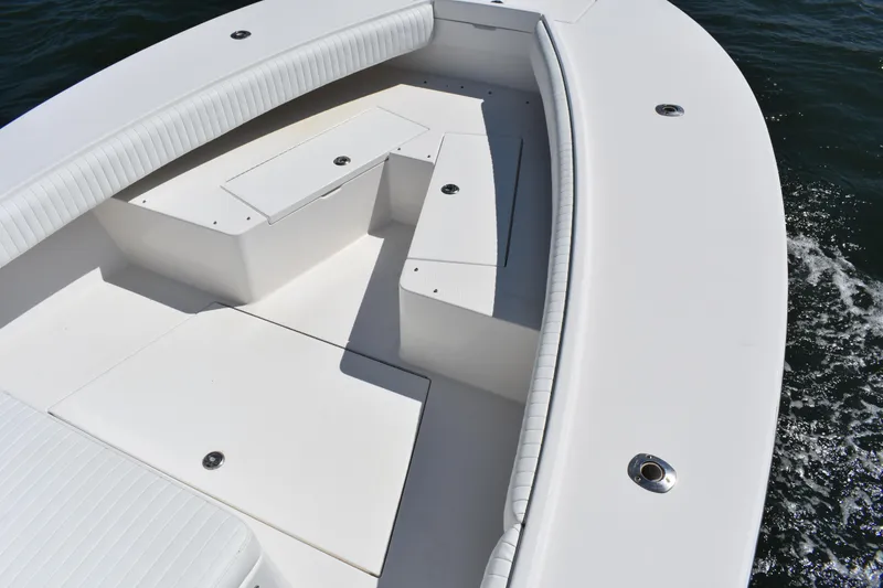 Slide: The Image of 2008 Regulator 32 Forward Seating boat with spacious white deck and seating area. - 10