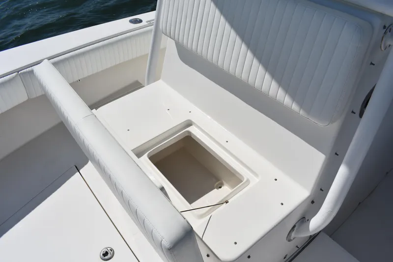 Slide: The Image of 2008 Regulator 32 Forward Seating boat with open storage compartment. - 15