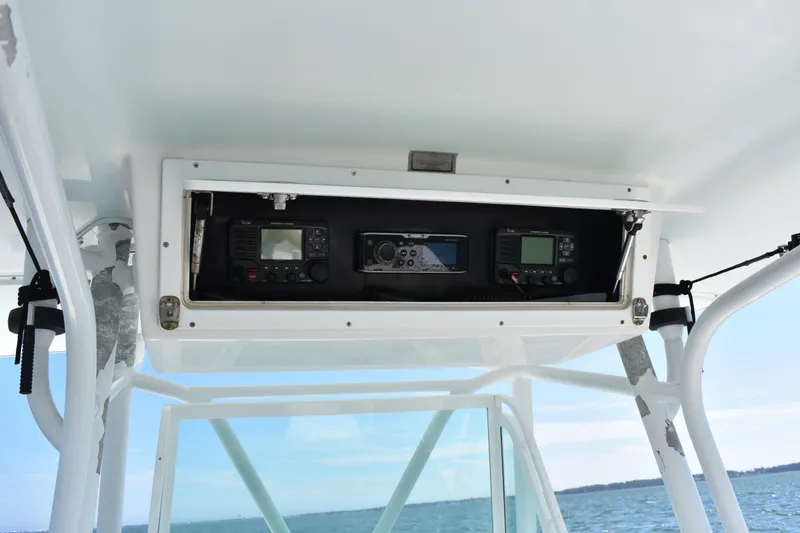 Slide: The Image of 2008 Regulator 32 Forward Seating boat electronics compartment with navigation equipment. - 21