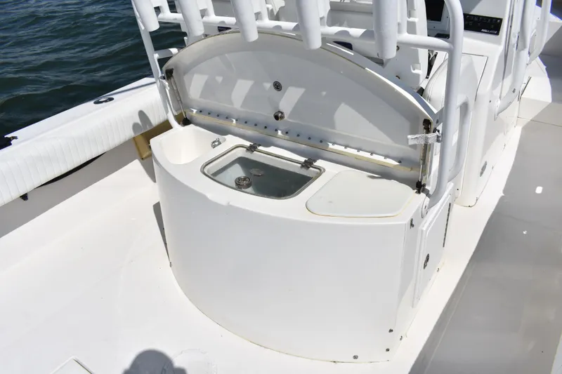 Slide: The Image of 2008 Regulator 32 Forward Seating boat interior with open storage compartment. - 26