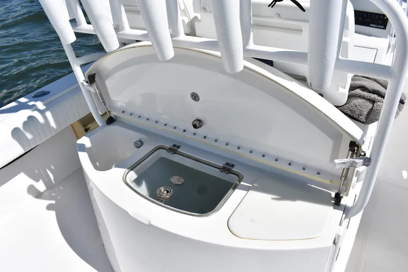 Slide: The Image of 2008 Regulator 32 Forward Seating boat with open storage compartment on deck. - 27