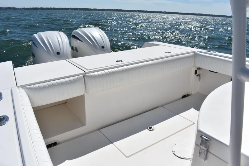 Slide: The Image of 2008 Regulator 32 Forward Seating boat with twin Yamaha engines on open water. - 30