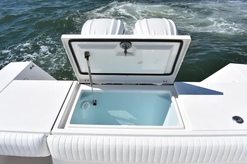 Slide: The Image of 2008 Regulator 32 Forward Seating boat with open storage compartment on deck. - 33