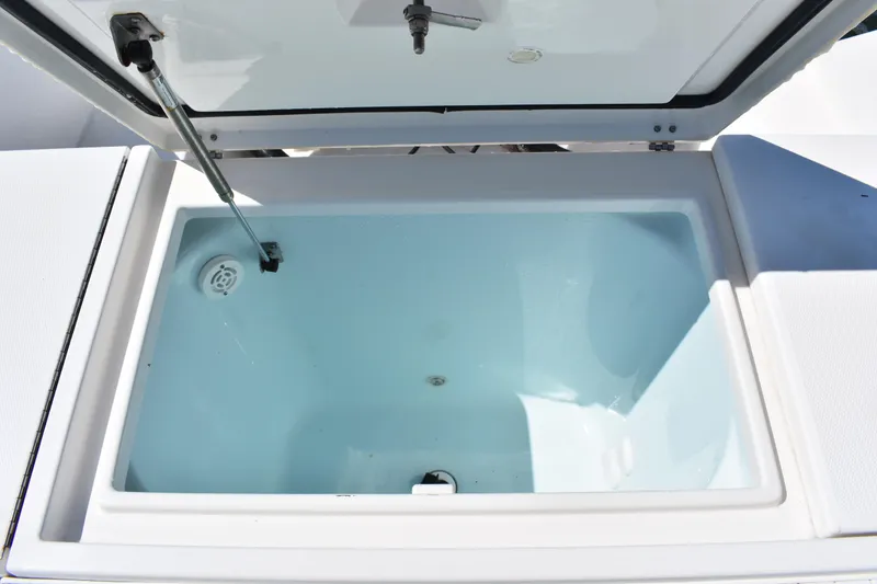 Slide: The Image of Open storage compartment on 2008 Regulator 32 Forward Seating boat. - 34
