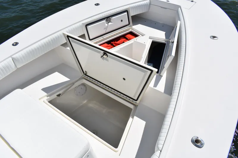Slide: The Image of 2008 Regulator 32 Forward Seating boat with open storage compartments on deck. - 8
