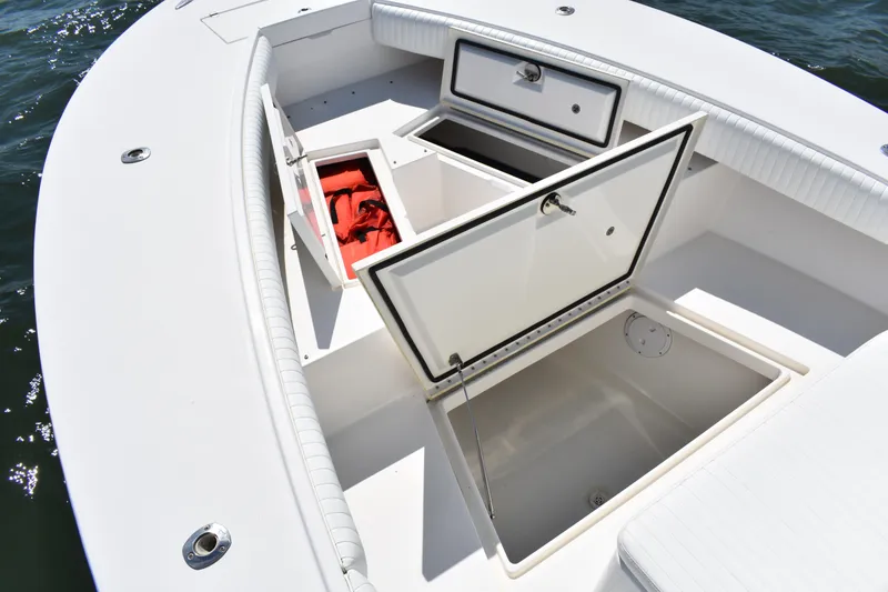Slide: The Image of 2008 Regulator 32 Forward Seating boat with open storage compartments on deck. - 9