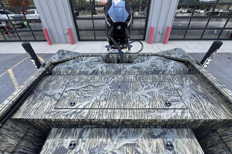 Slide: The Image of 2026 SeaArk 2272 MV FlatKat boat with camo design and powerful outboard motor. - 11