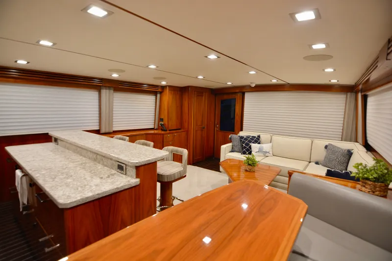 Slide: The Image of Luxurious interior of 2019 Viking 68 Convertible yacht with elegant seating and modern decor. - 13