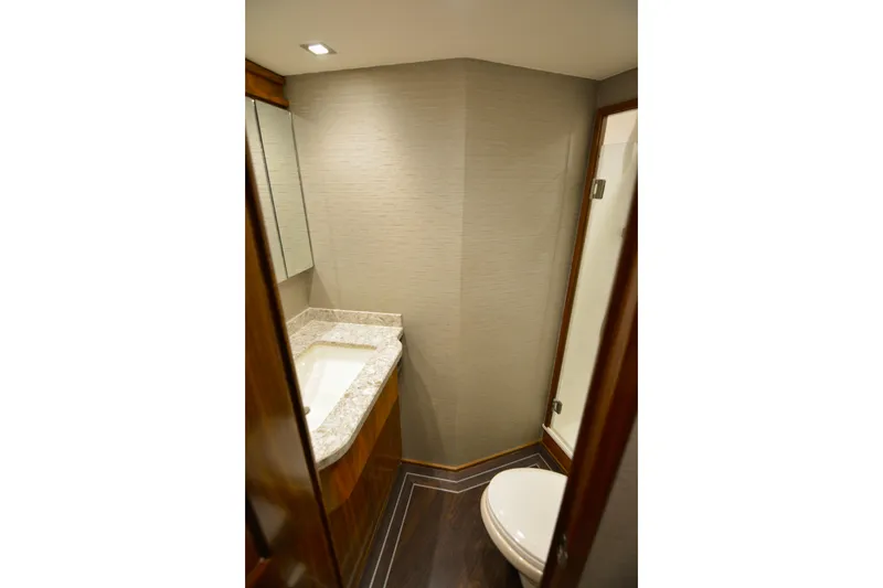 Slide: The Image of Luxurious bathroom in 2019 Viking 68 Convertible yacht with modern fixtures and elegant design. - 31