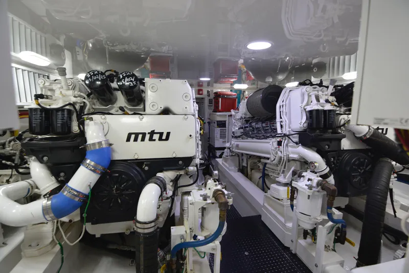 Slide: The Image of Engine room of a 2019 Viking 68 Convertible yacht featuring MTU engines. - 36