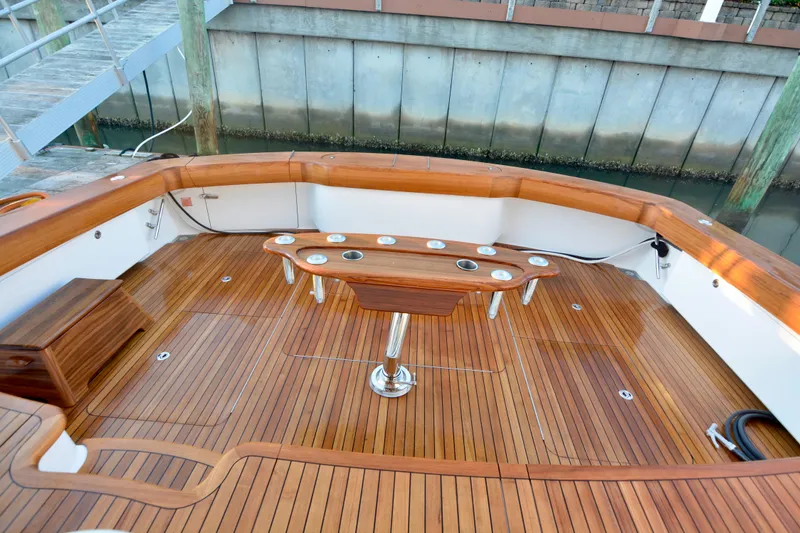 Slide: The Image of Luxurious teak deck of 2019 Viking 68 Convertible yacht with fishing rod holders. - 38
