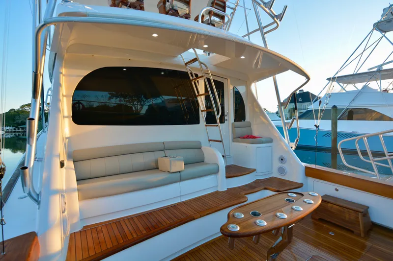 Slide: The Image of 2019 Viking 68 Convertible yacht with elegant seating and wooden deck. - 41